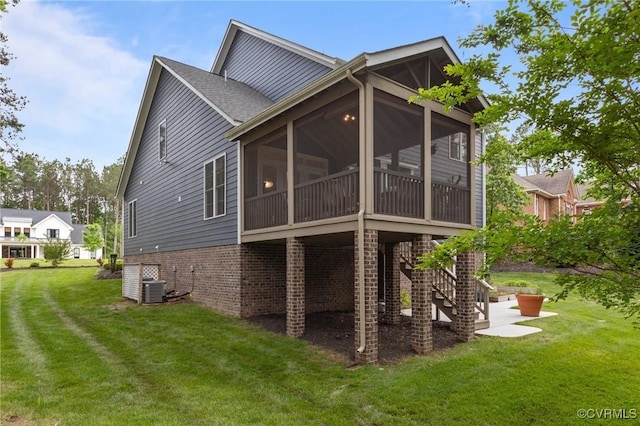 5530 Tyshire Pkwy, Providence Forge, VA 23140 - rear view of property with a sunroom, a lawn, brick siding, and central air condition unit