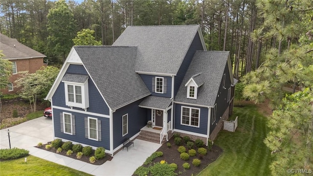5530 Tyshire Pkwy, Providence Forge, VA 23140 - view of front of property with a shingled roof, a front lawn, and concrete driveway