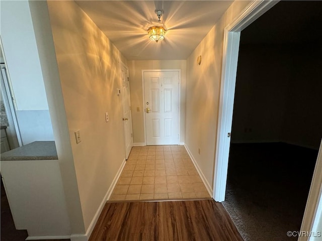 301 Beacon Ridge Dr Unit 607, Hopewell, VA 23860 - corridor featuring baseboards and tile patterned floors