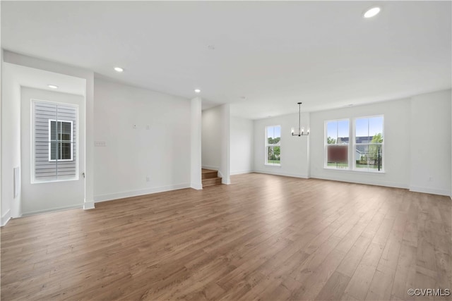 12129 Morning Walk, Henrico, VA 23233 - unfurnished living room featuring a chandelier, light wood-style floors, recessed lighting, and baseboards