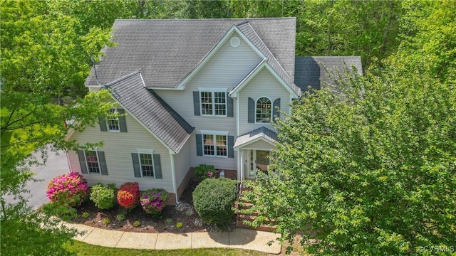 view of front of house featuring roof with shingles