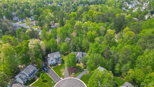 bird's eye view featuring a residential view and a forest view