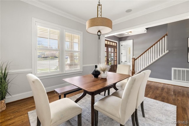 1300 Baltrey Ln, Midlothian, VA 23112 - dining area featuring wood finished floors, crown molding, baseboards, and stairway