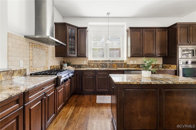 1300 Baltrey Ln, Midlothian, VA 23112 - kitchen with wall chimney range hood, appliances with stainless steel finishes, a sink, dark wood-type flooring, and dark brown cabinetry
