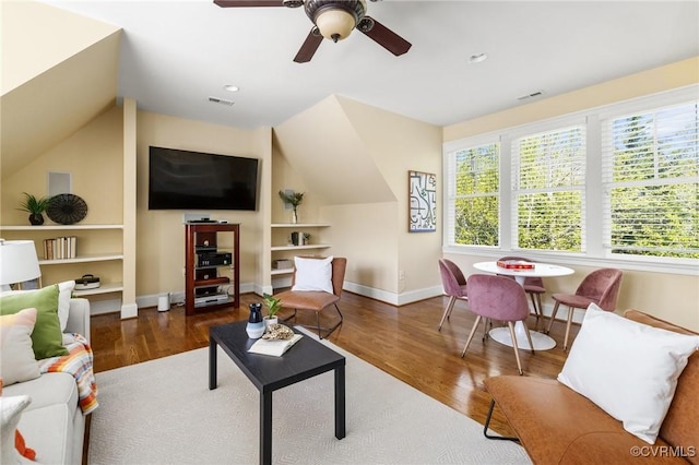 1300 Baltrey Ln, Midlothian, VA 23112 - living room featuring built in features, lofted ceiling, wood finished floors, ceiling fan, and baseboards