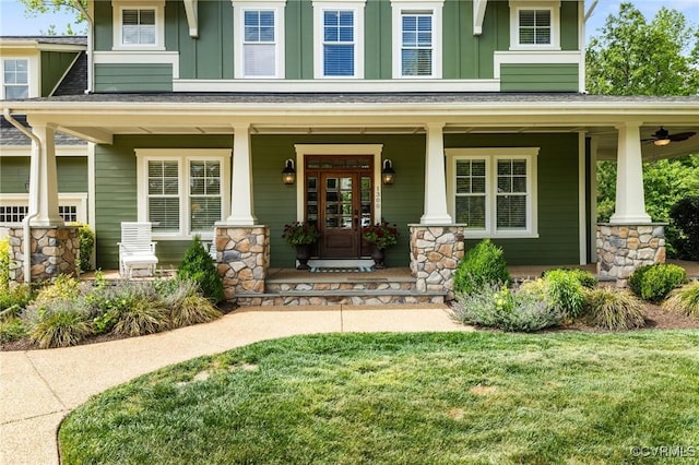 1300 Baltrey Ln, Midlothian, VA 23112 - property entrance featuring covered porch, board and batten siding, stone siding, and a lawn