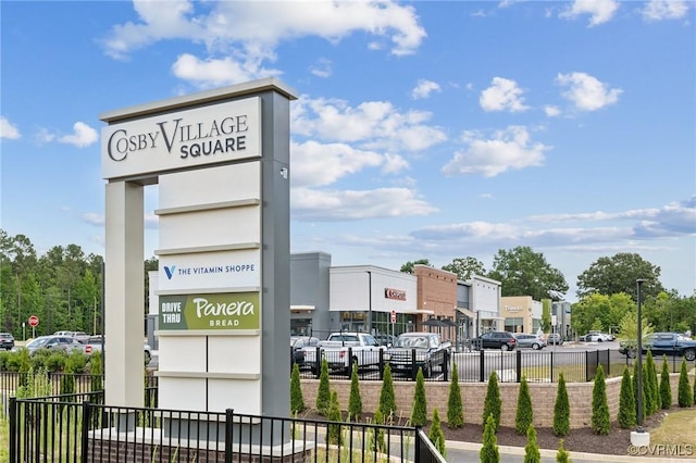 exterior space with uncovered parking and fence