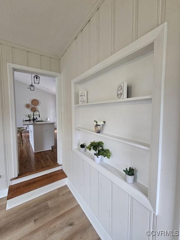 3109 Comet Rd, Richmond, VA 23294 - corridor with built in features, a decorative wall, and wood finished floors
