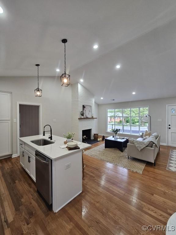 3109 Comet Rd, Richmond, VA 23294 - kitchen featuring stainless steel dishwasher, open floor plan, vaulted ceiling, and a sink