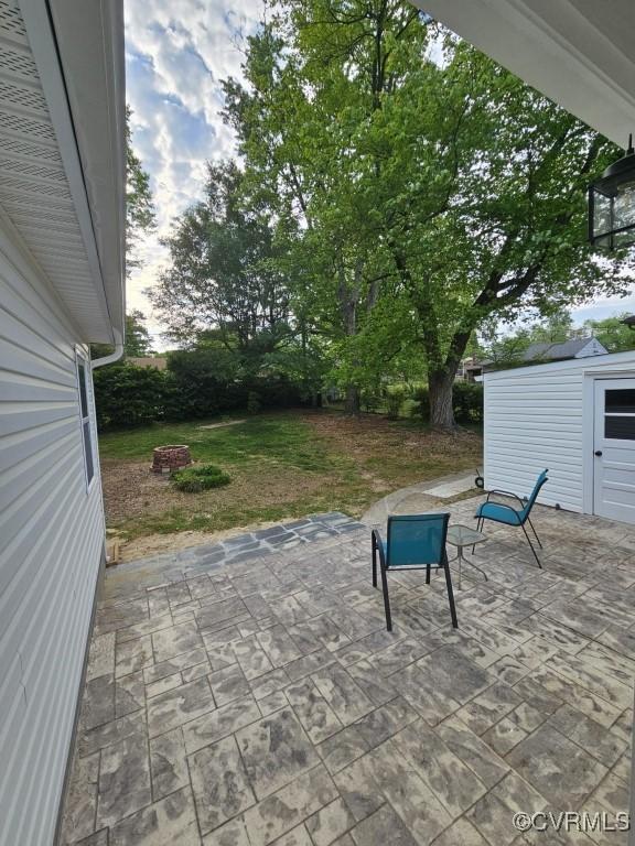 3109 Comet Rd, Richmond, VA 23294 - view of patio / terrace with a storage unit and an outbuilding