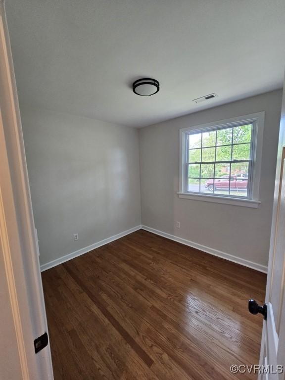 3109 Comet Rd, Richmond, VA 23294 - spare room with baseboards, dark wood-style flooring, and visible vents