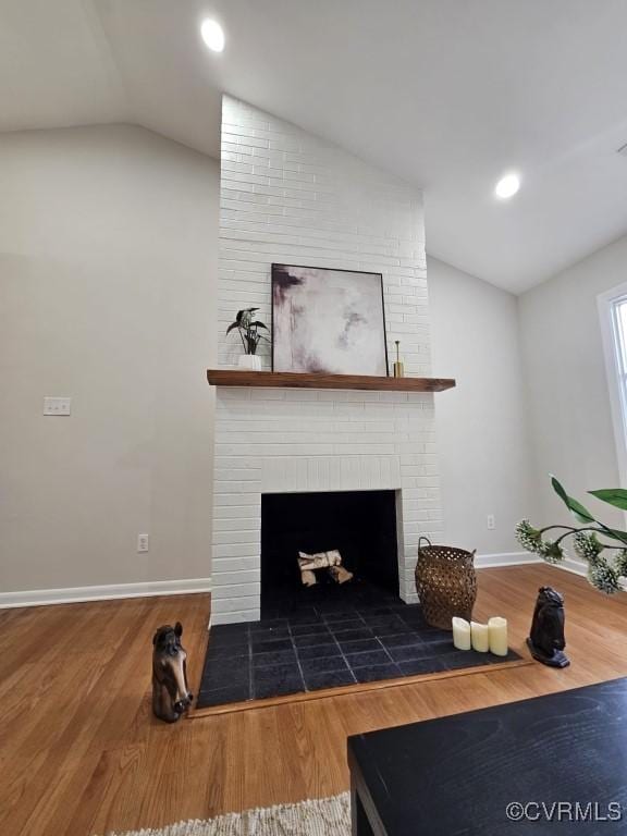 3109 Comet Rd, Richmond, VA 23294 - living area with baseboards, a brick fireplace, wood finished floors, and lofted ceiling