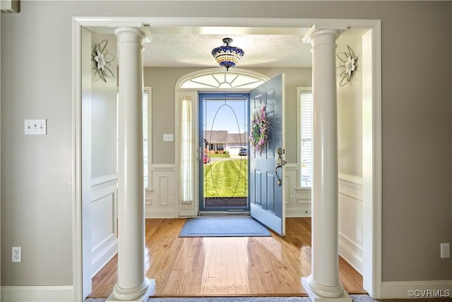 106 Kennon Pointe Ct, Colonial Heights, VA 23834 - entryway with a decorative wall, ornate columns, wood finished floors, and a wainscoted wall