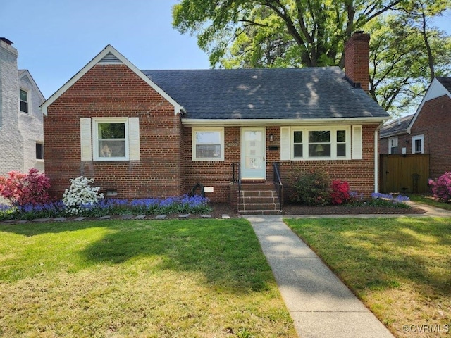3905 W Grace St, Richmond, VA 23230 - view of front of home with brick siding, a chimney, roof with shingles, and entry steps