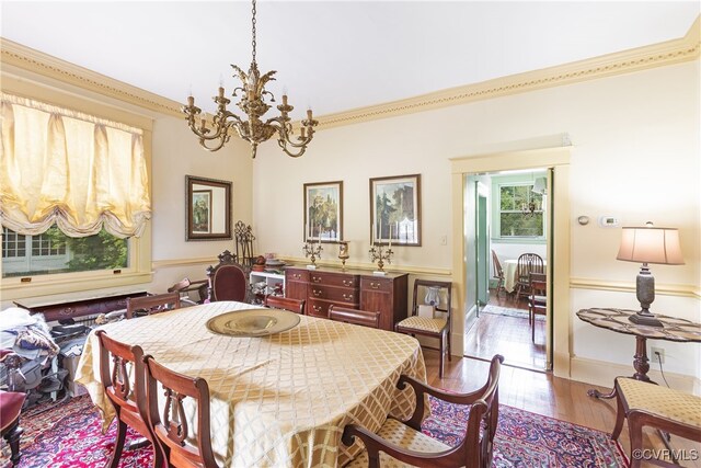 1731 Westover Ave, Petersburg, VA 23805 - dining room with a chandelier, wood finished floors, and crown molding