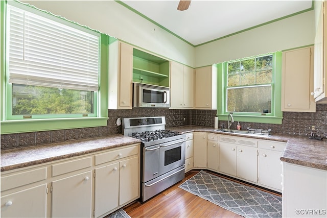 1731 Westover Ave, Petersburg, VA 23805 - kitchen with stainless steel appliances, a sink, backsplash, light wood-style floors, and open shelves