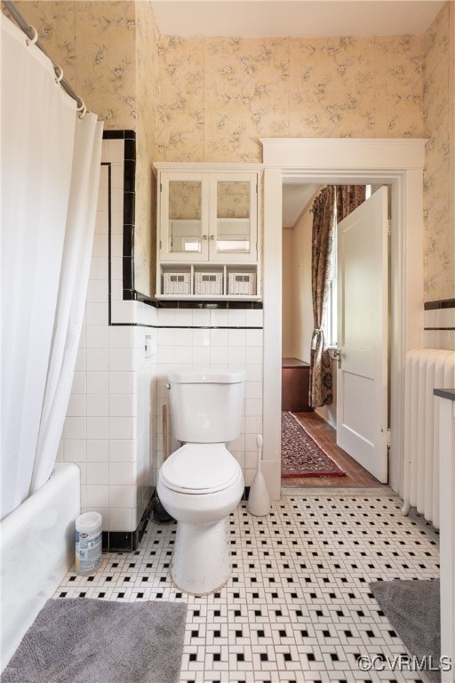 1731 Westover Ave, Petersburg, VA 23805 - full bath with wallpapered walls, toilet, radiator, tile patterned floors, and shower / bath combination with curtain