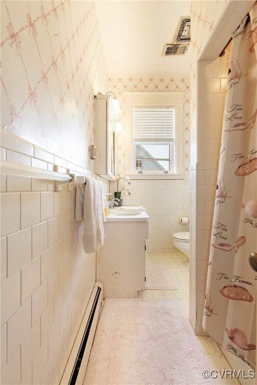 1731 Westover Ave, Petersburg, VA 23805 - bathroom featuring tile walls, toilet, vanity, wallpapered walls, and curtained shower