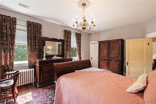 1731 Westover Ave, Petersburg, VA 23805 - bedroom with a chandelier, radiator heating unit, and wood finished floors