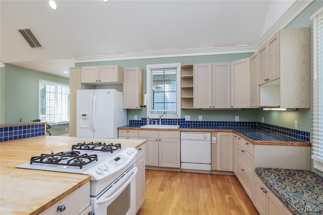 kitchen featuring visible vents, open shelves, a sink, white appliances, and light wood-style flooring