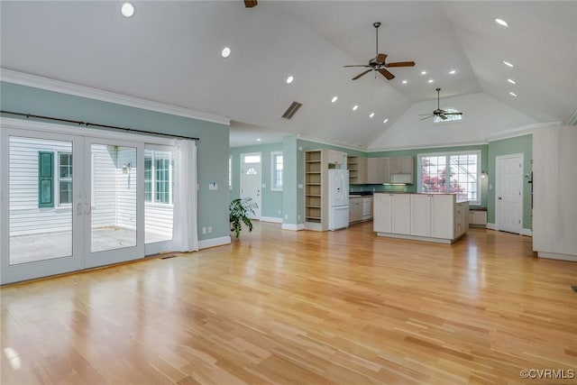 unfurnished living room featuring a ceiling fan, recessed lighting, plenty of natural light, and visible vents