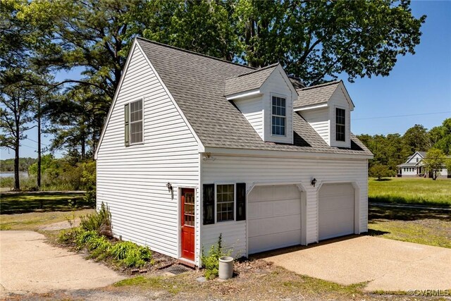 view of home's exterior featuring roof with shingles