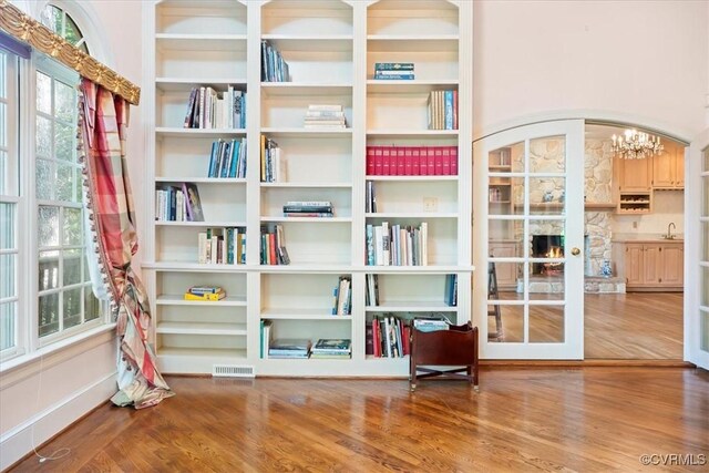 419 Dellbrooks Pl, Henrico, VA 23238 - sitting room with wood finished floors, a chandelier, and french doors