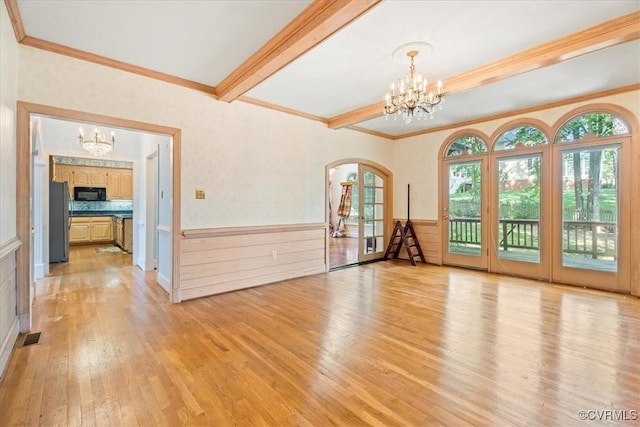 419 Dellbrooks Pl, Henrico, VA 23238 - unfurnished room with a chandelier, light wood-style floors, crown molding, plenty of natural light, and wainscoting