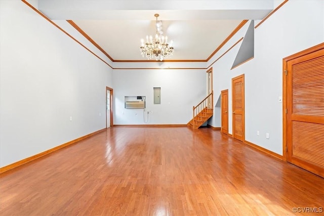 419 Dellbrooks Pl, Henrico, VA 23238 - unfurnished living room with a chandelier, wood finished floors, ornamental molding, stairway, and baseboards