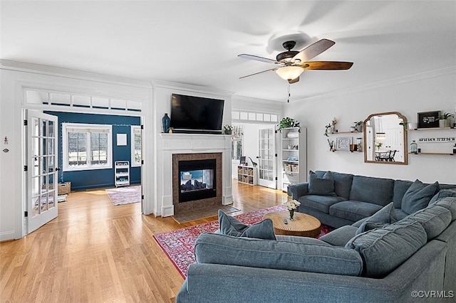 13325 Shore Lake Turn, Chesterfield, VA 23838 - living area featuring french doors, light wood finished floors, a tile fireplace, crown molding, and ceiling fan