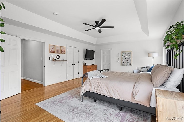 13325 Shore Lake Turn, Chesterfield, VA 23838 - bedroom with light wood-type flooring, a tray ceiling, and ceiling fan