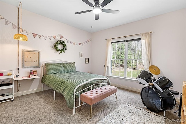 bedroom with carpet flooring, ceiling fan, and baseboards