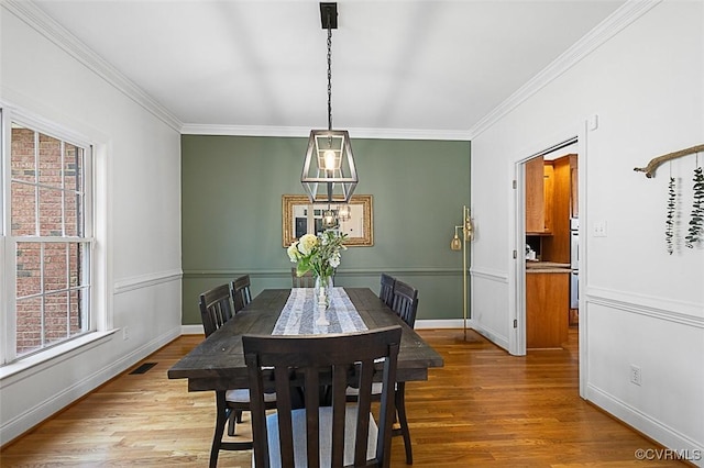 13325 Shore Lake Turn, Chesterfield, VA 23838 - dining space with ornamental molding, healthy amount of natural light, and wood finished floors