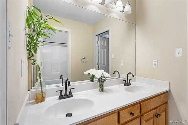 bathroom featuring double vanity and a sink