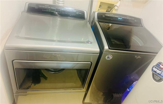 washroom featuring washer and clothes dryer and laundry area