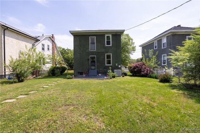 3220 Cliff Ave, Richmond, VA 23222 - back of house with central air condition unit, stucco siding, and entry steps
