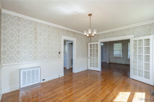 3220 Cliff Ave, Richmond, VA 23222 - unfurnished room with a chandelier, wainscoting, wood finished floors, french doors, and crown molding