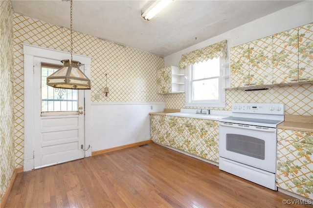 3220 Cliff Ave, Richmond, VA 23222 - kitchen featuring white electric stove, wallpapered walls, wood finished floors, light countertops, and open shelves