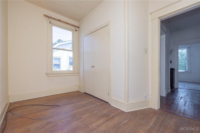 3220 Cliff Ave, Richmond, VA 23222 - unfurnished bedroom featuring wood-type flooring, baseboards, and a closet