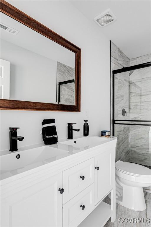427 Harding St, Petersburg, VA 23803 - full bathroom featuring toilet, a sink, visible vents, and a stall shower