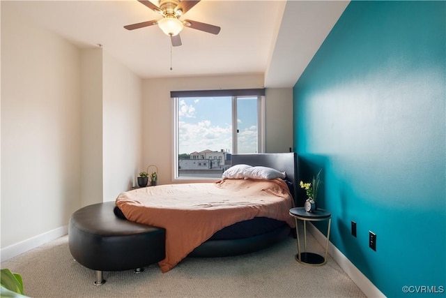 bedroom with baseboards, carpet flooring, and ceiling fan