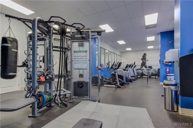gym featuring a drop ceiling