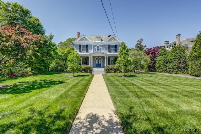view of front of house with a front lawn