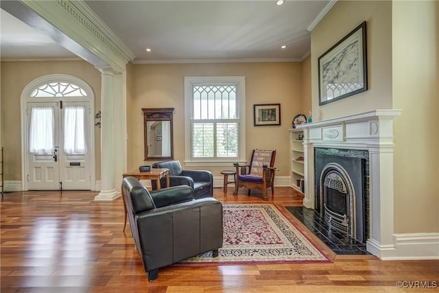 living room featuring wood finished floors and a wealth of natural light