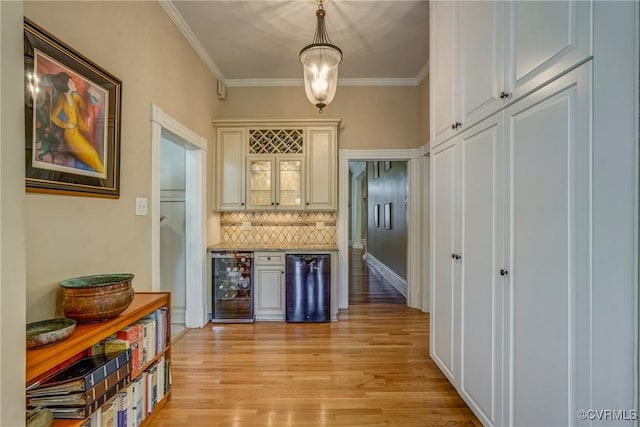 hallway featuring light wood-type flooring, crown molding, and wine cooler