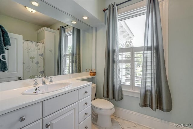 full bathroom with vanity, tile patterned flooring, and toilet
