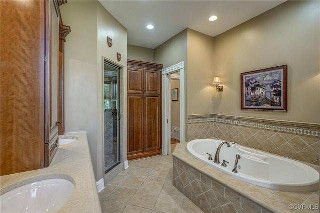 full bathroom with tile patterned flooring, vanity, recessed lighting, a bath, and a stall shower