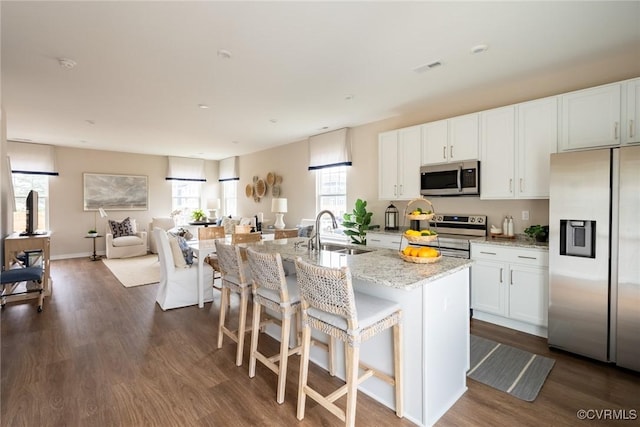 4188 Park Trail Dr Unit U-5, Henrico, VA 23223 - kitchen with a sink, stainless steel appliances, white cabinets, light stone countertops, and dark wood-style floors