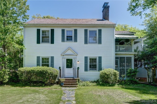 4821 W Seminary Ave, Richmond, VA 23227 - colonial inspired home featuring a chimney, a front yard, and entry steps