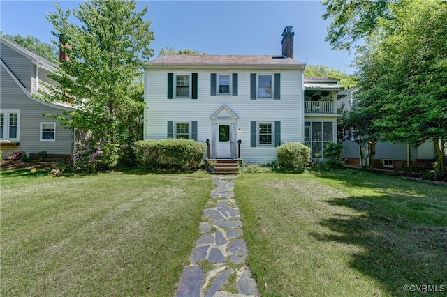 4821 W Seminary Ave, Richmond, VA 23227 - colonial home featuring a chimney, a front yard, and a balcony